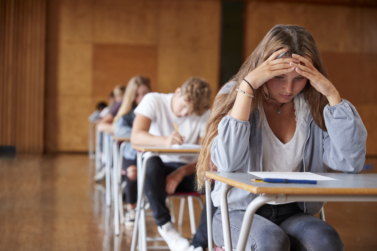 young girl with anxiety while taking a test.