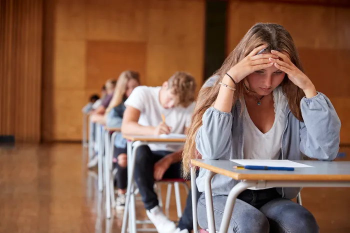 young girl with anxiety while taking a test.