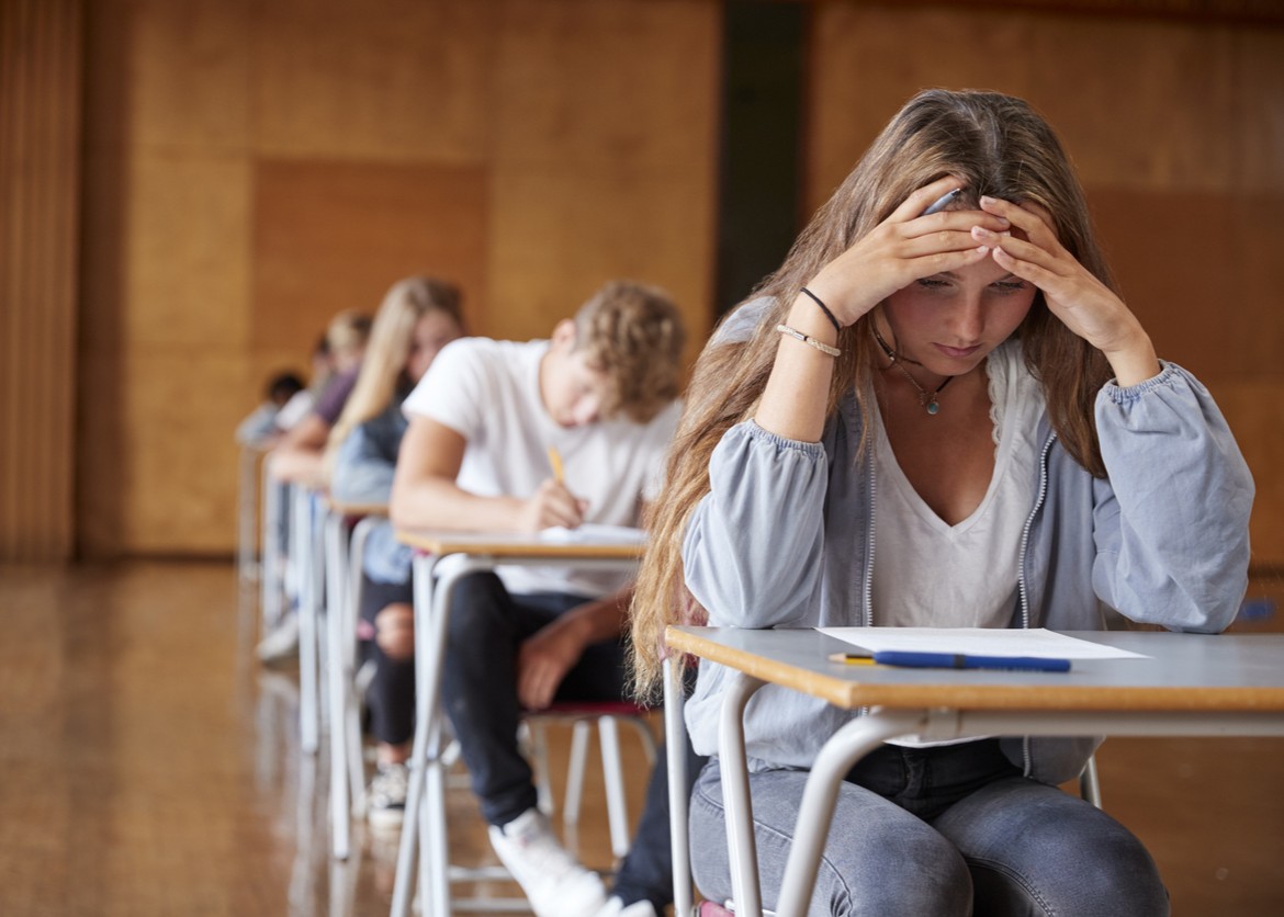young girl with anxiety while taking a test.